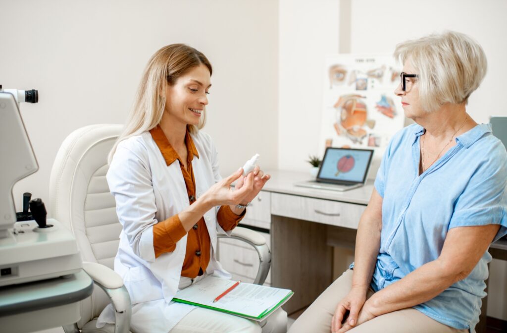 An optometrist goes over proper eye drop use with a patient.